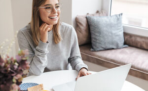 woman happy laptop