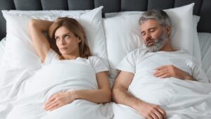 Sleeping at the same time as your partner could harm your sleep, warn researchers